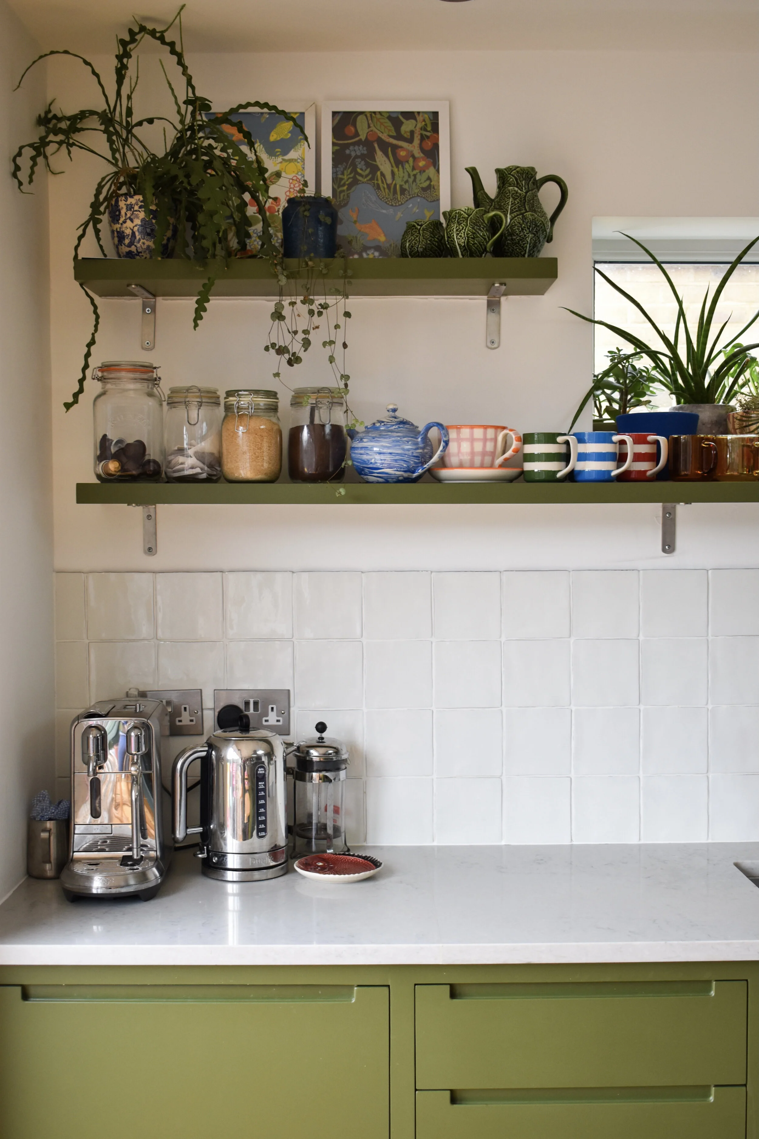 The kitchen units are painted Olive Green by Little Greene