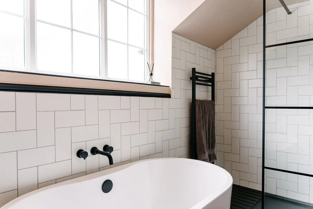 The bathroom walls are painted in Farrow &amp; Ball Setting Plaster