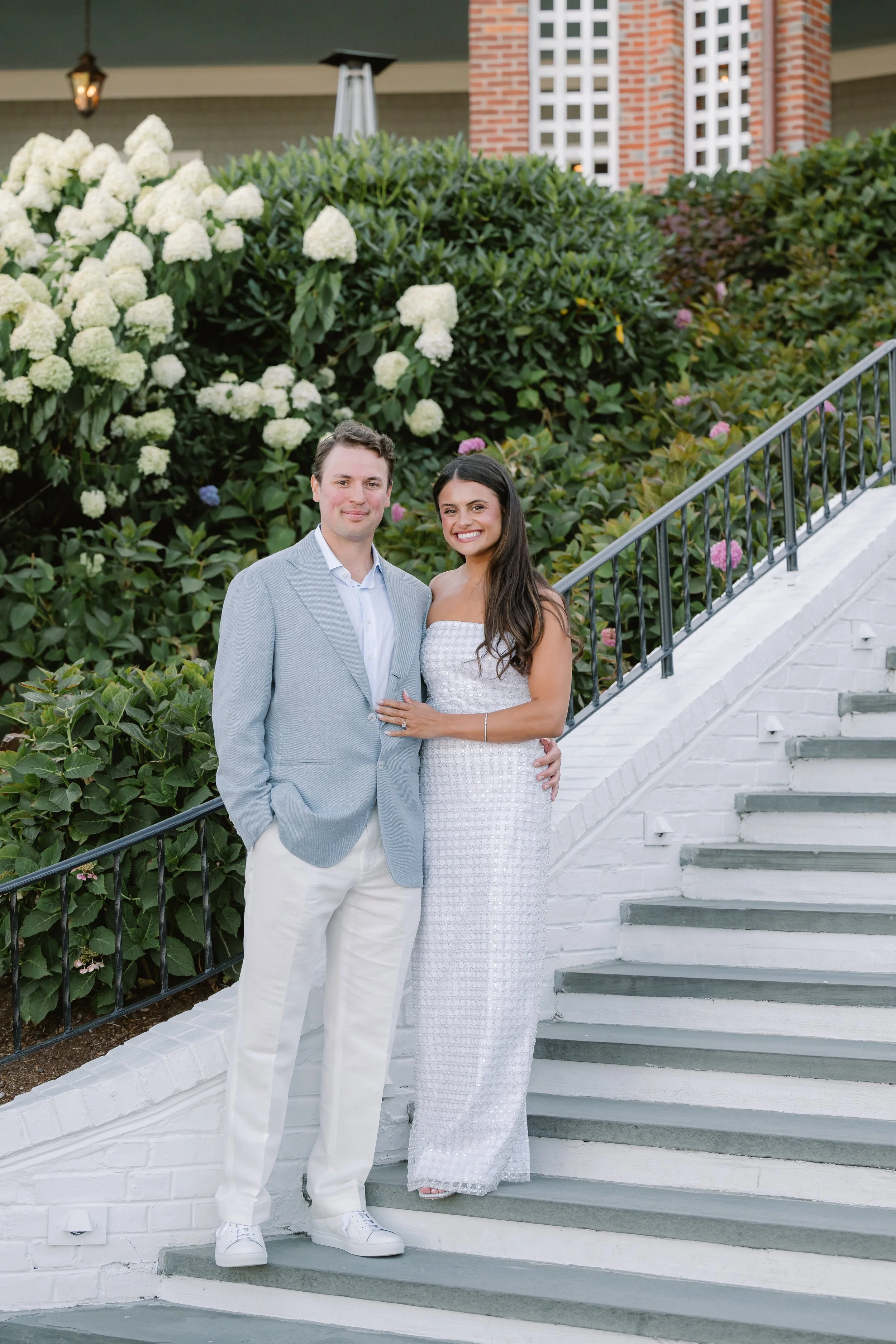 Elegant coastal wedding rehearsal dinner bride and groom