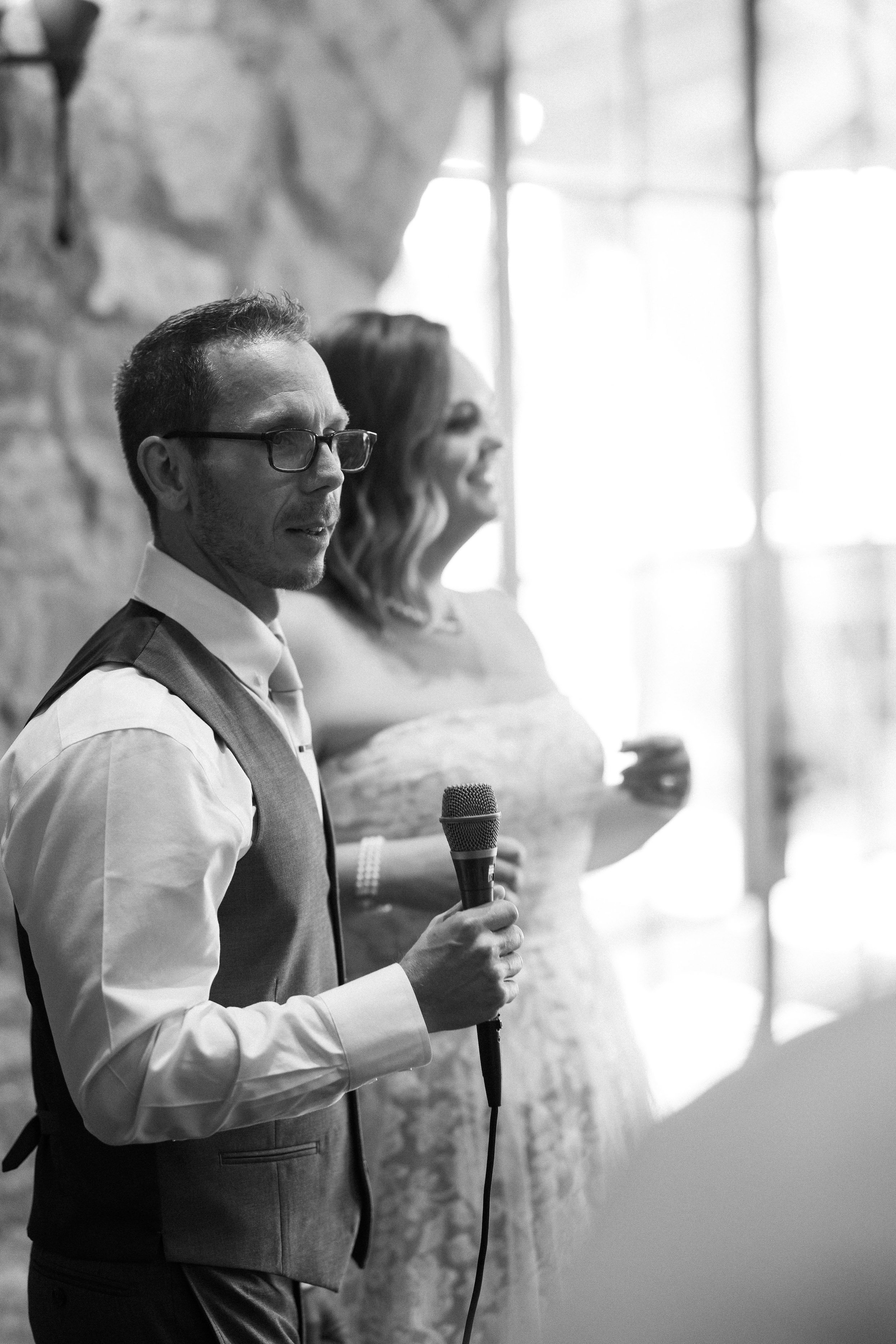 Bride and Groom Give Toast at Wedding Rehearsal Dinner