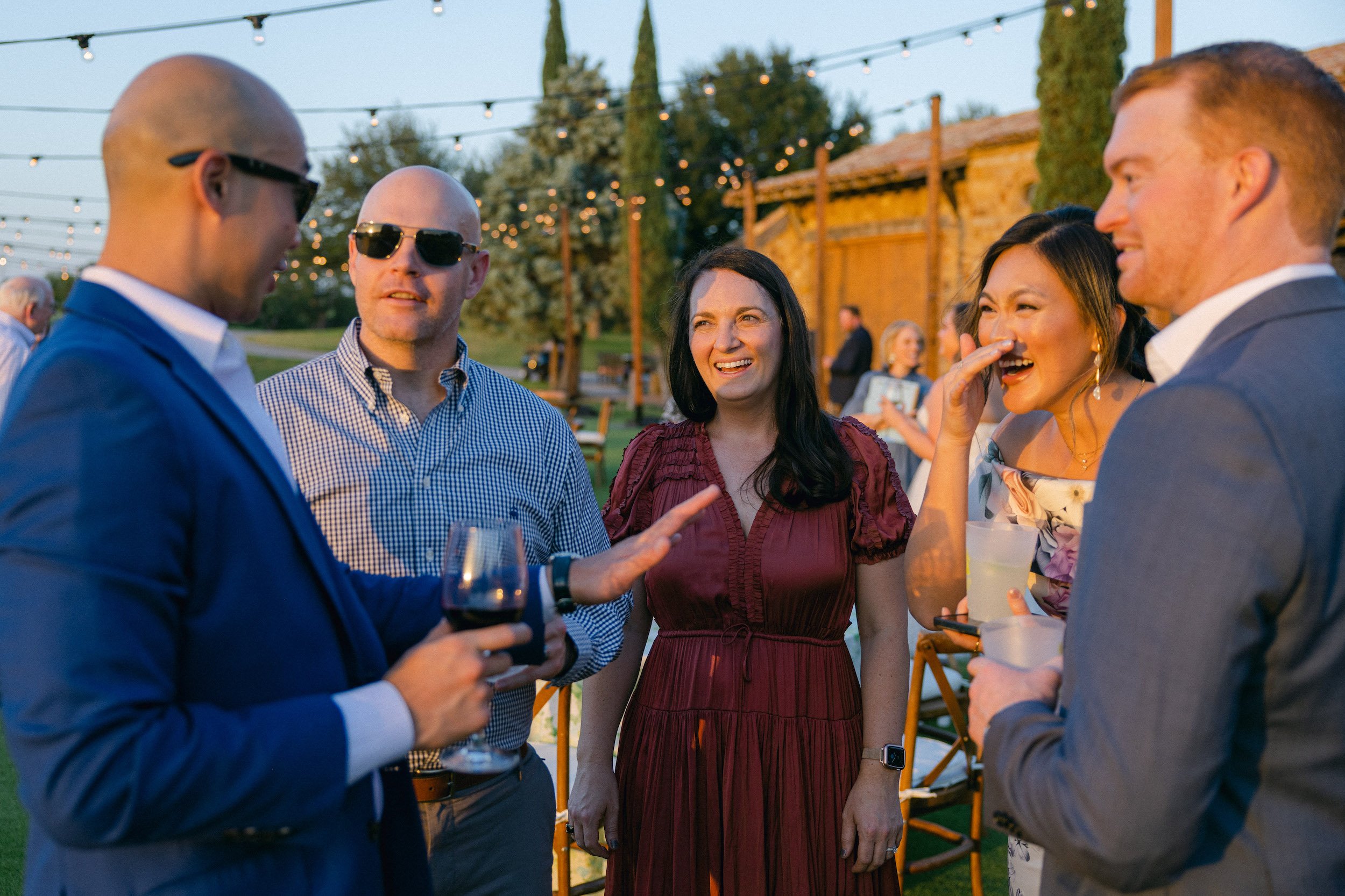 Guests Enjoy Cocktails Outdoors at Texas Rehearsal Dinner