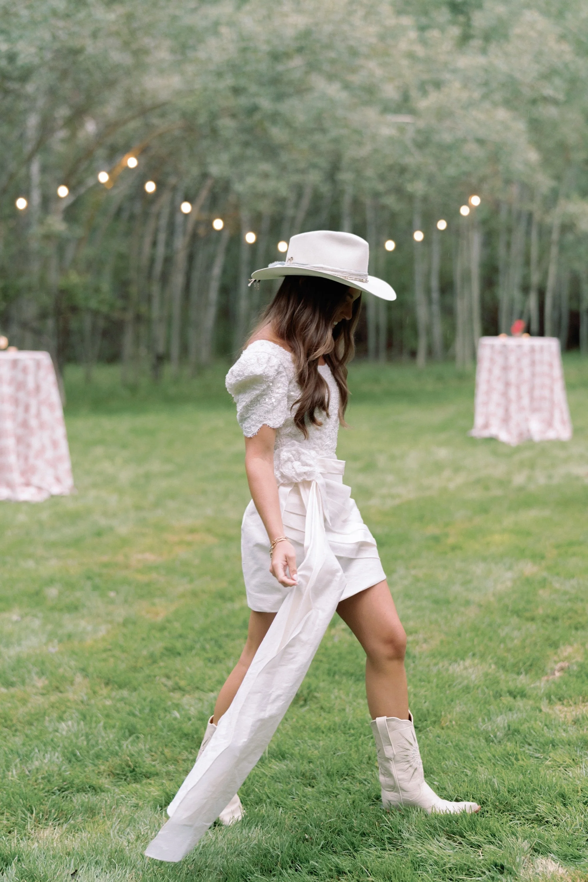 bride-unique-white-dress-boots-hat-refined-colorado-countryside-wedding-rehearsal-dinner-western-backyard-lets-get-rehearsed.JPG