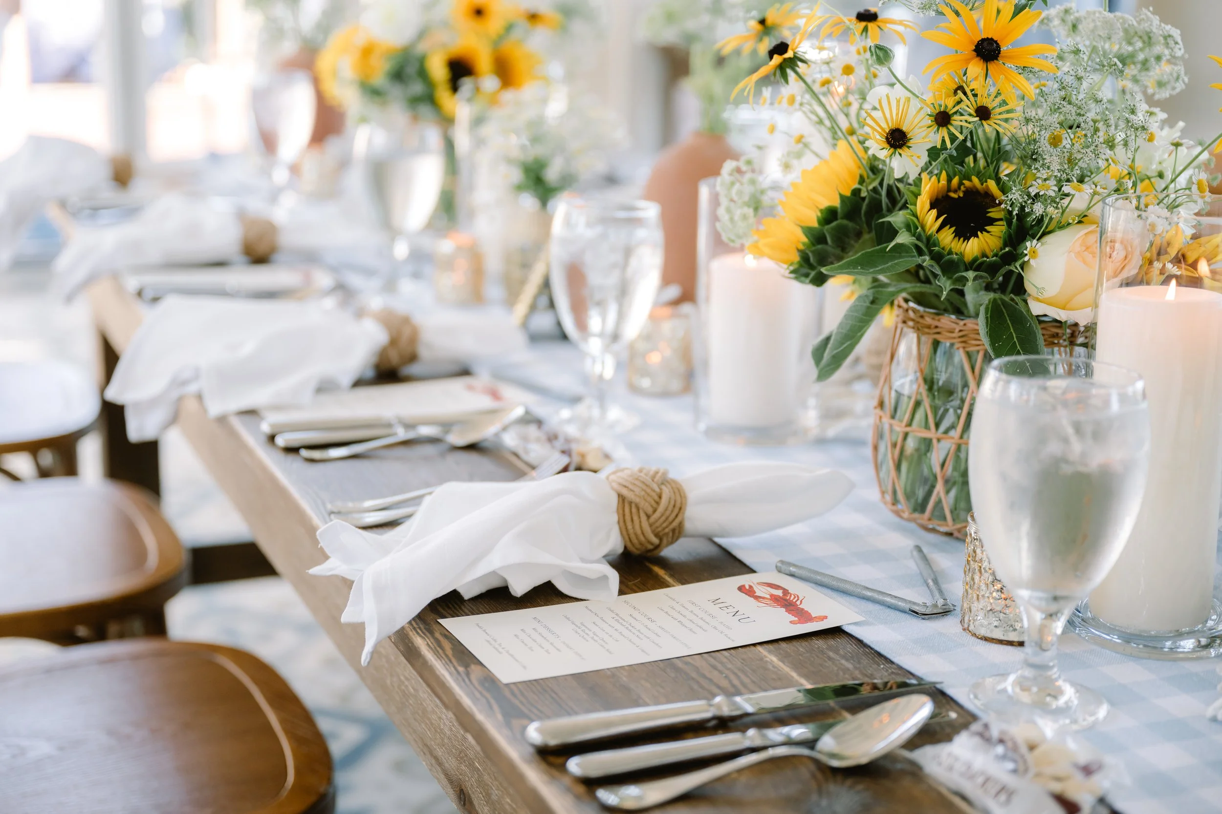 Elegant coastal wedding rehearsal dinner table setting