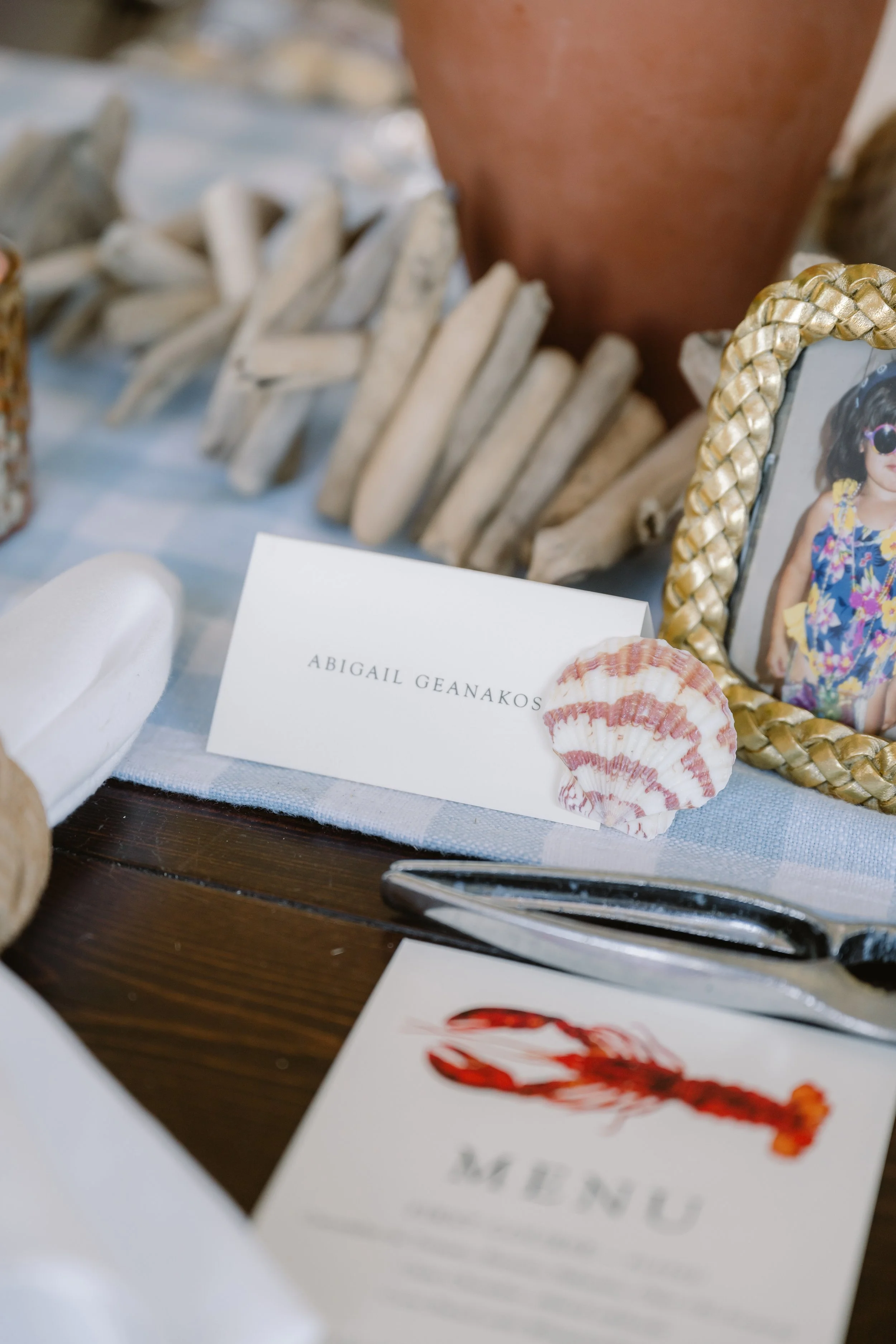 Elegant coastal wedding rehearsal dinner table setting