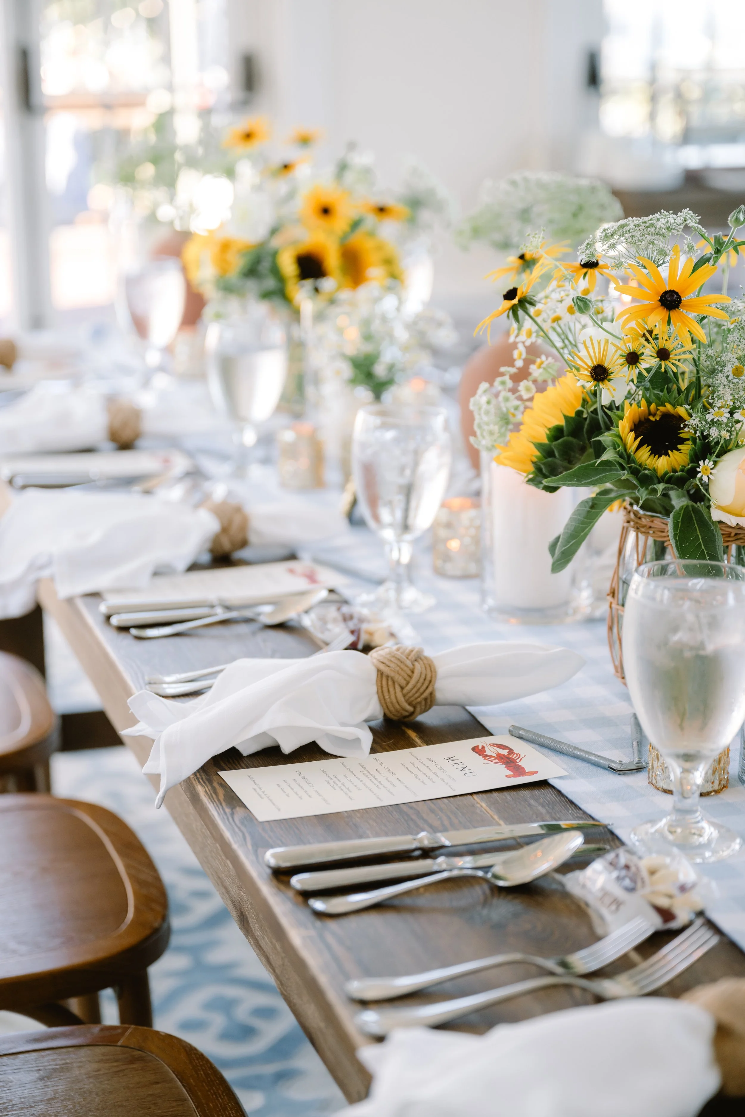 Elegant coastal wedding rehearsal dinner table setting
