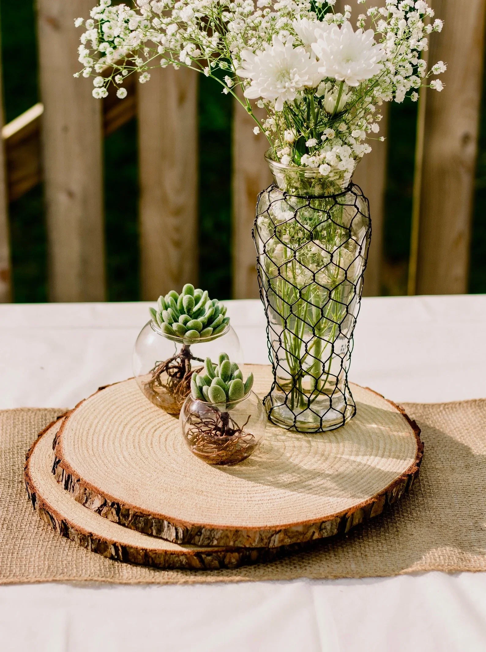 wood-slice-rehearsal-dinner-centerpiece.webp