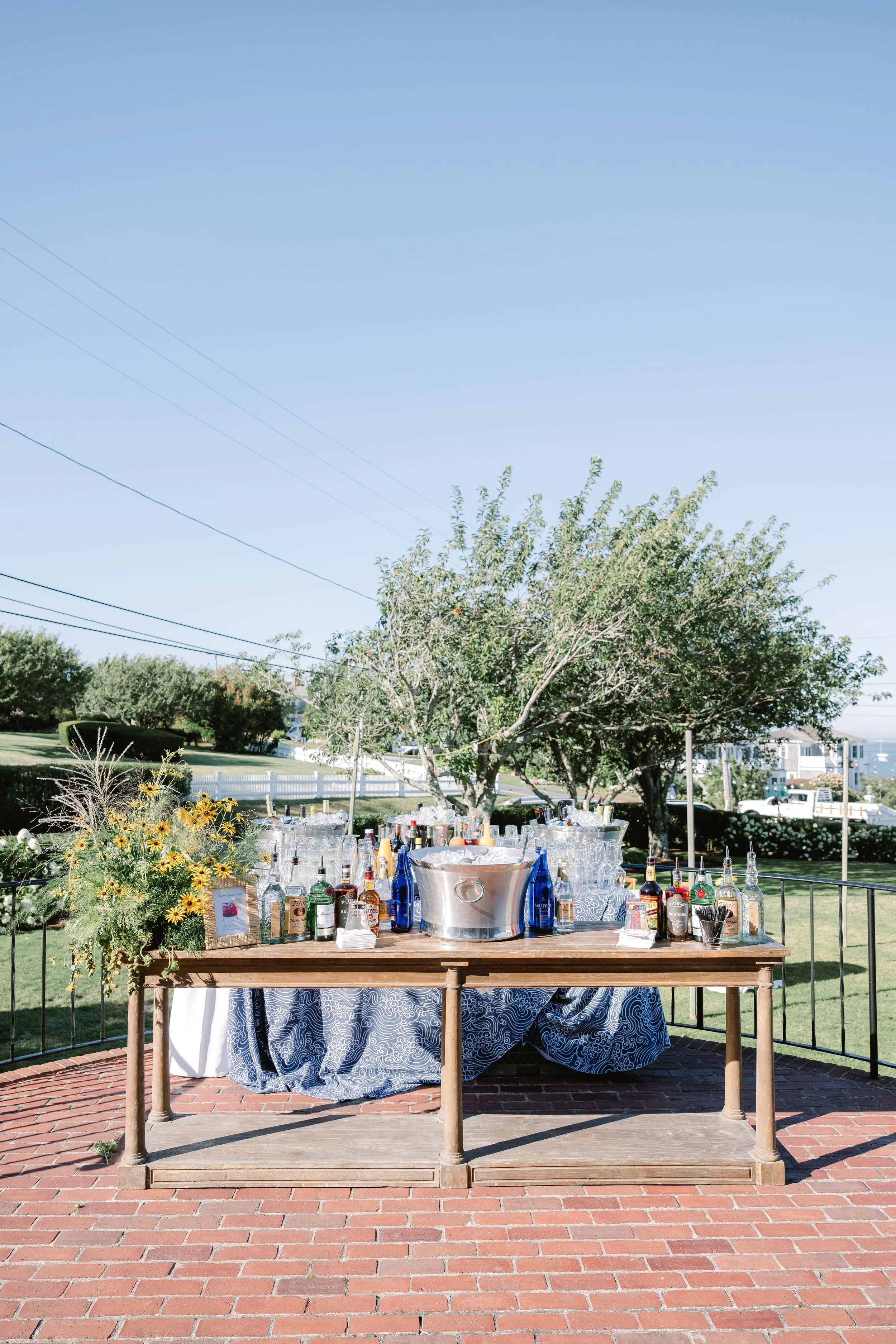 Elegant coastal wedding rehearsal dinner outdoor bar