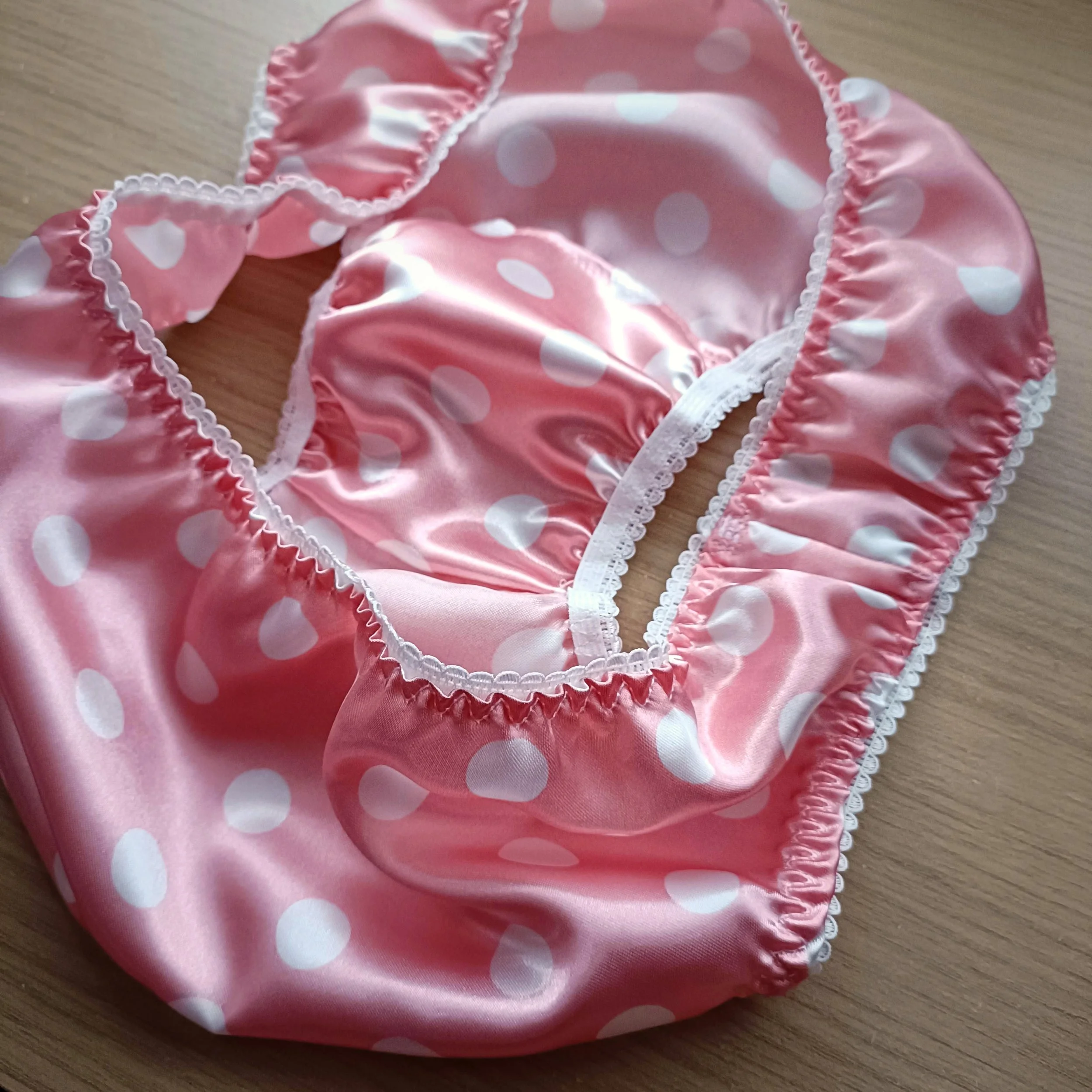 Handmade pink polka dot satin panties by Naseeb Kaur, tailored for men, exuding sophistication and comfort.
