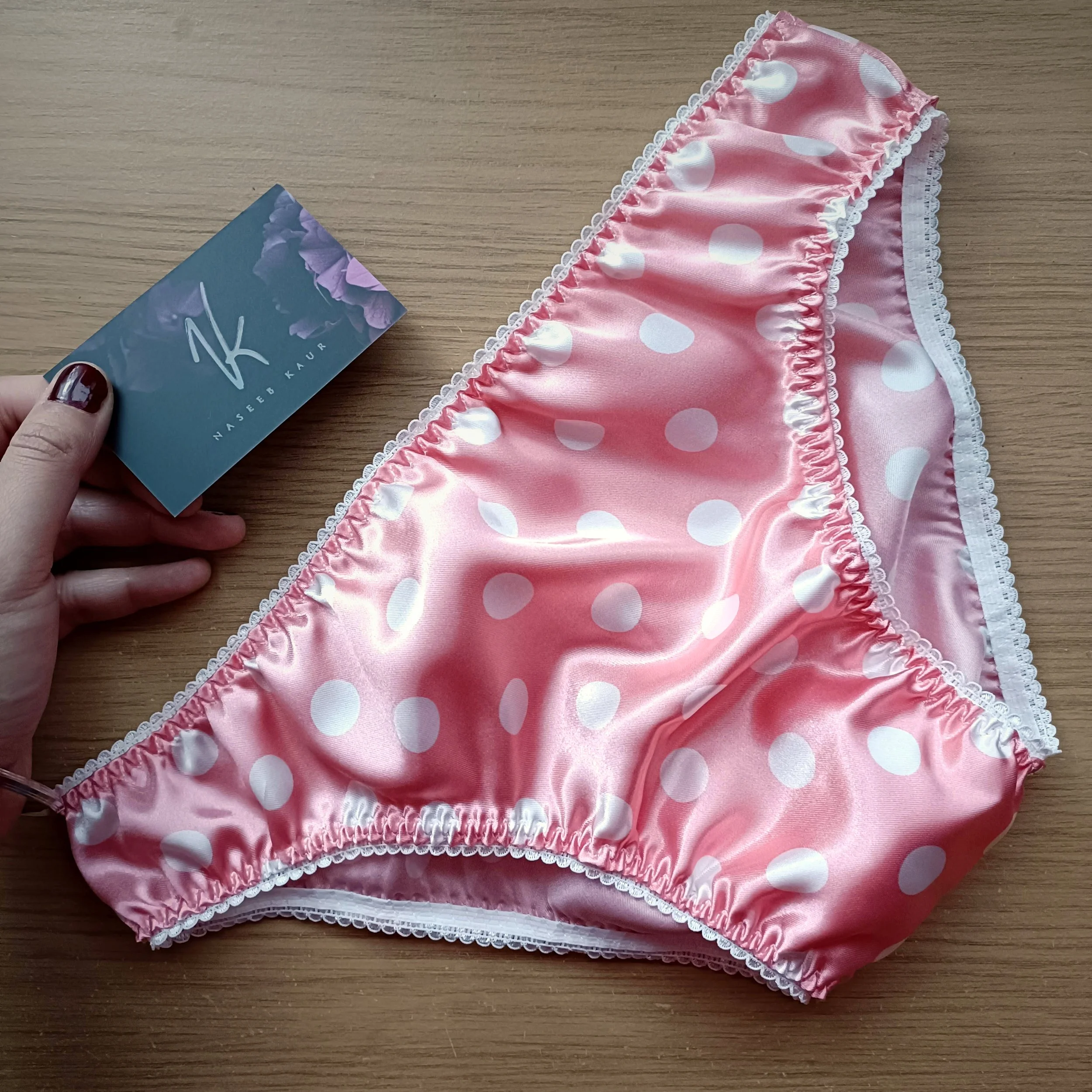 Handmade pink polka dot satin panties by Naseeb Kaur, tailored for men, exuding sophistication and comfort.