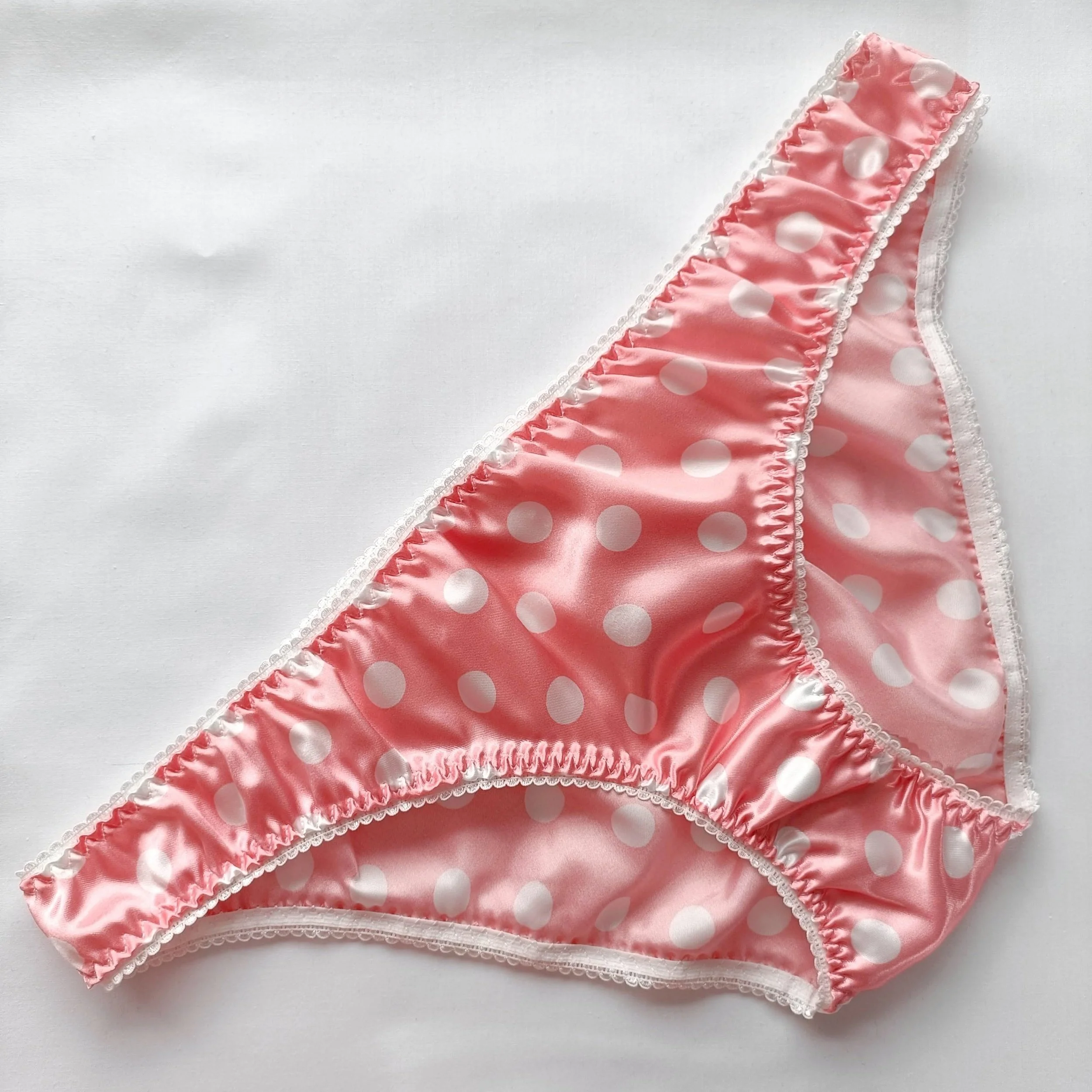 Handmade pink polka dot satin panties by Naseeb Kaur, tailored for women, epitomizing elegance and comfort.
