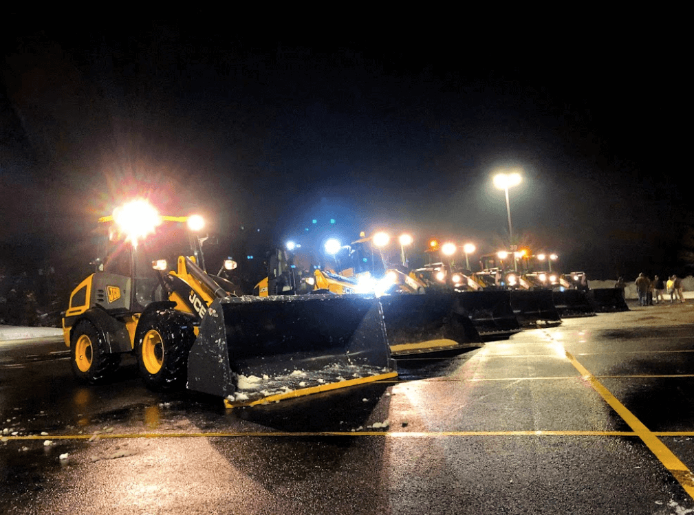 SnowX JCB Wheel Loader Line Up at Night with Lights.png