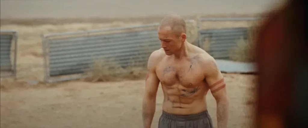 She-Rides-Shotgun-Taron-Egerton-shirtless.png.webp