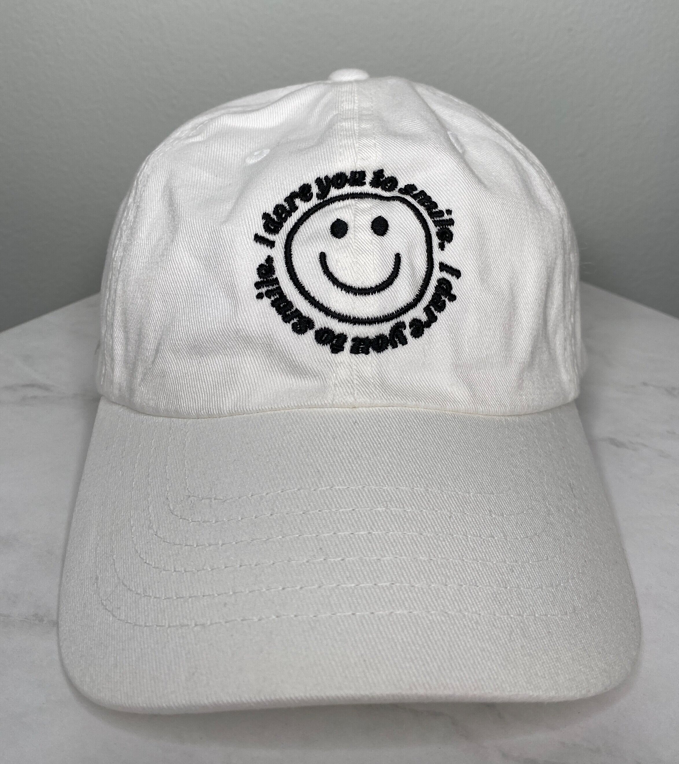 white+smile+hat+on+table.jpg
