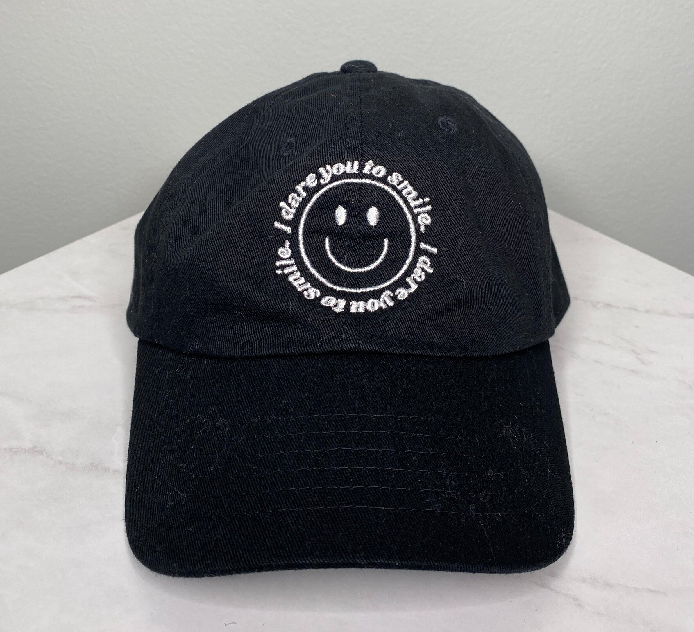 black+smile+hat+on+table.jpg