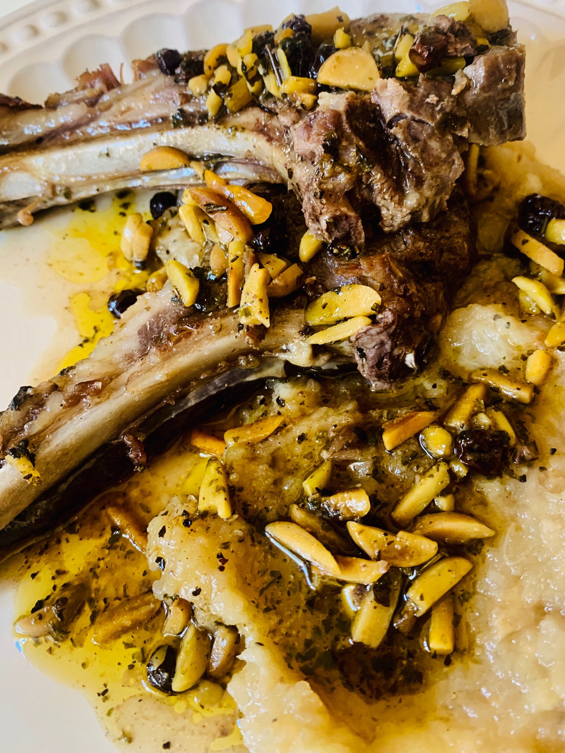 Rack of lamb in herbs, almonds and currants, served with mashed root vegetables