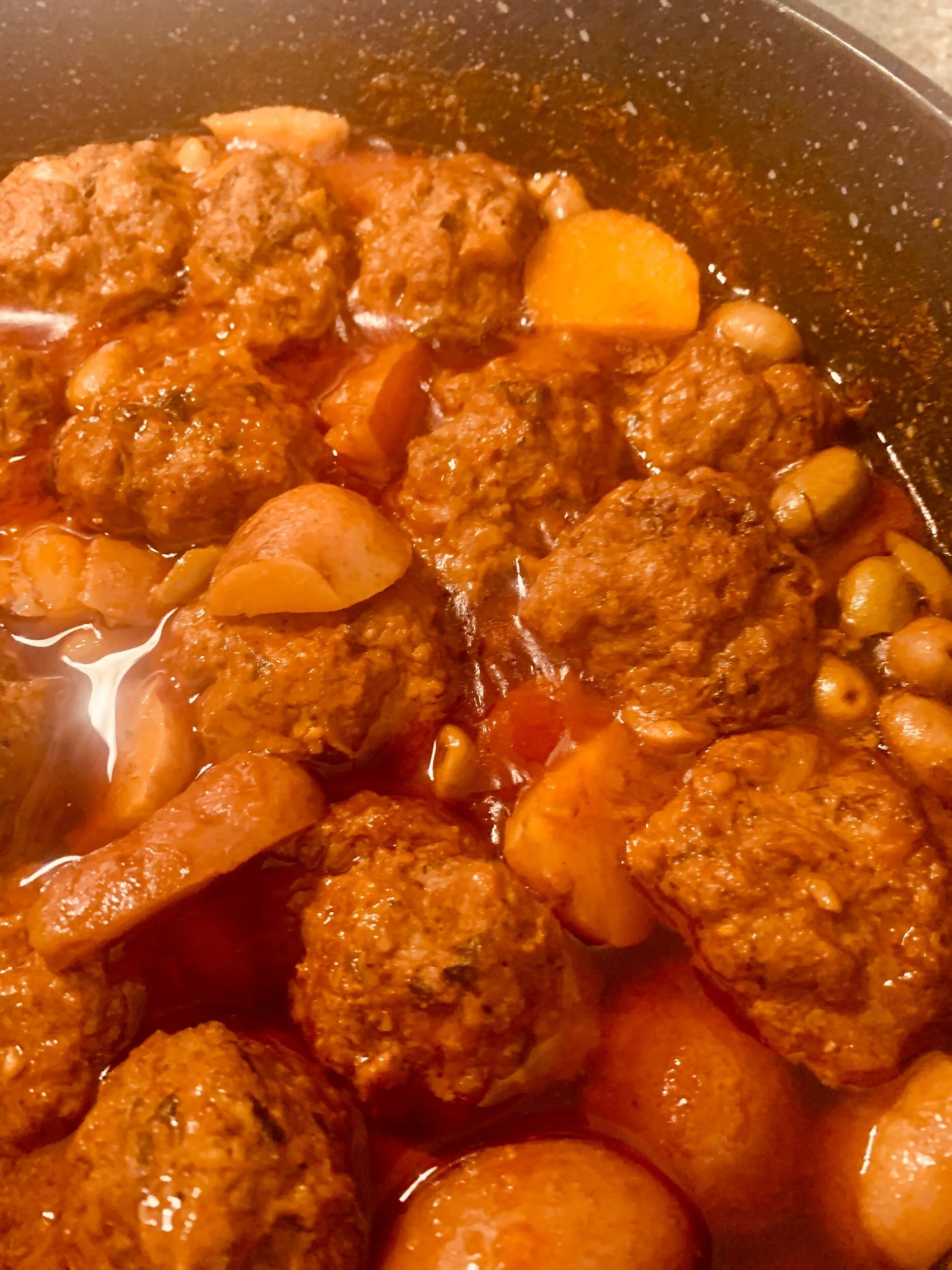 Smoked eggplant and beef meatballs with olives and baby potatoes