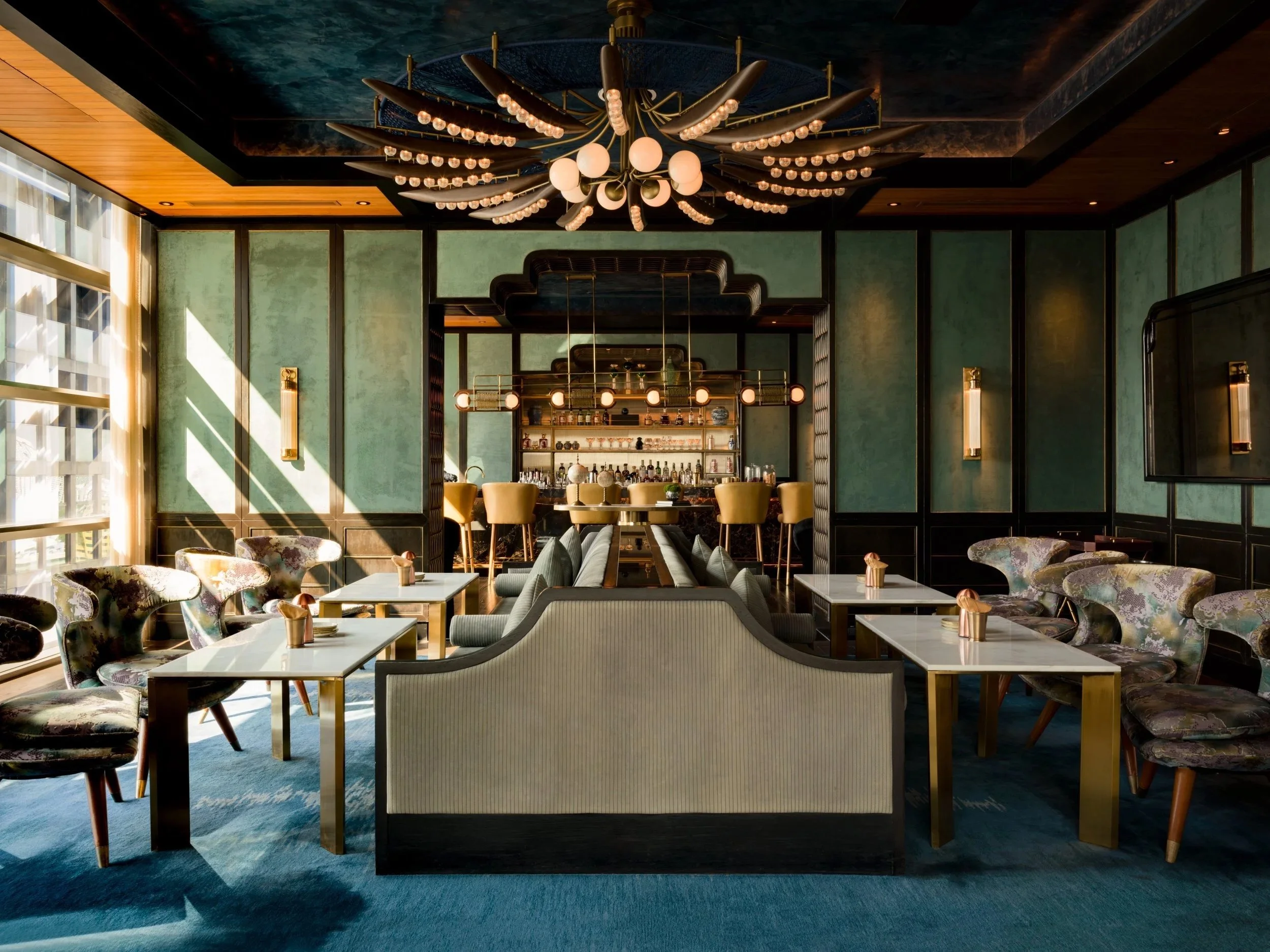 Rosewood Bangkok Nan Bei restaurant interior with rich textures, statement chandelier, and elegant dining layout, showcasing luxury hospitality interior design and architectural photographer work.