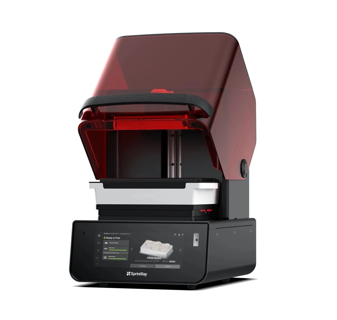 A medical 3D printer with a black base and a large red protective cover, digital touchscreen display, printing a dental model.