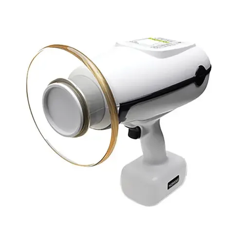 A handheld device connected to a clear glass eye model or lens with a beige rim.