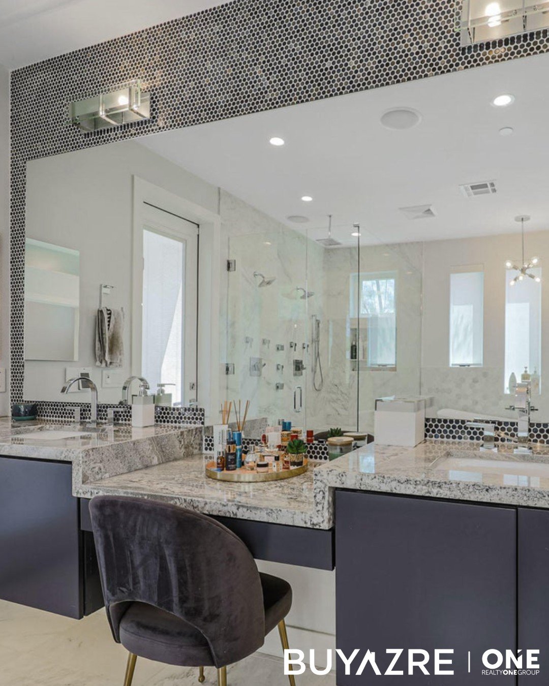 Can you imagine getting ready in here? 😍

Check out this sexy double vanity with a makeup station in between in this master bathroom! ✨ 

#bathroom #realestate #sleek