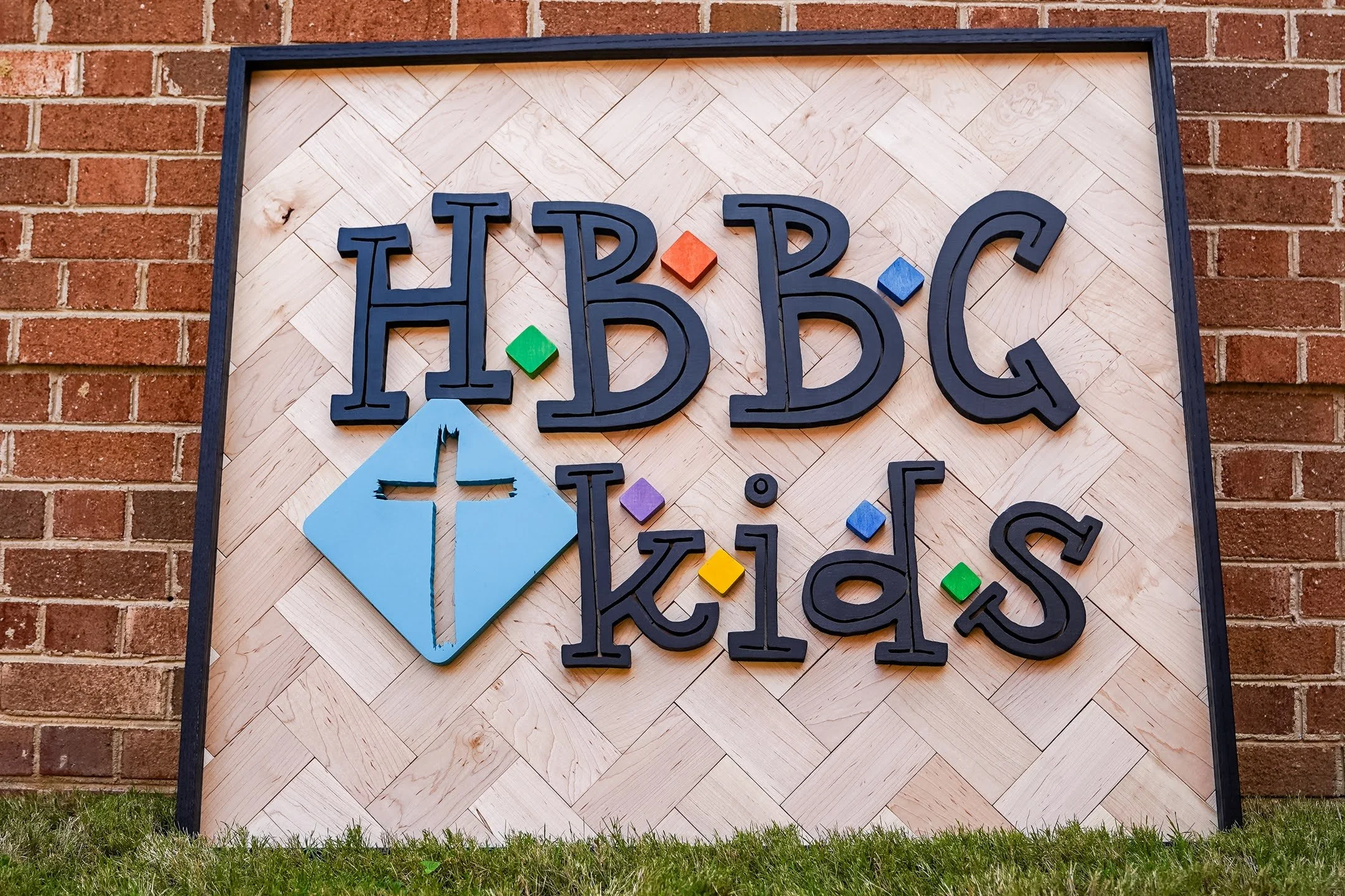 45x36 logo sign. Dyed hard maple and oak frame, herringbone backer.