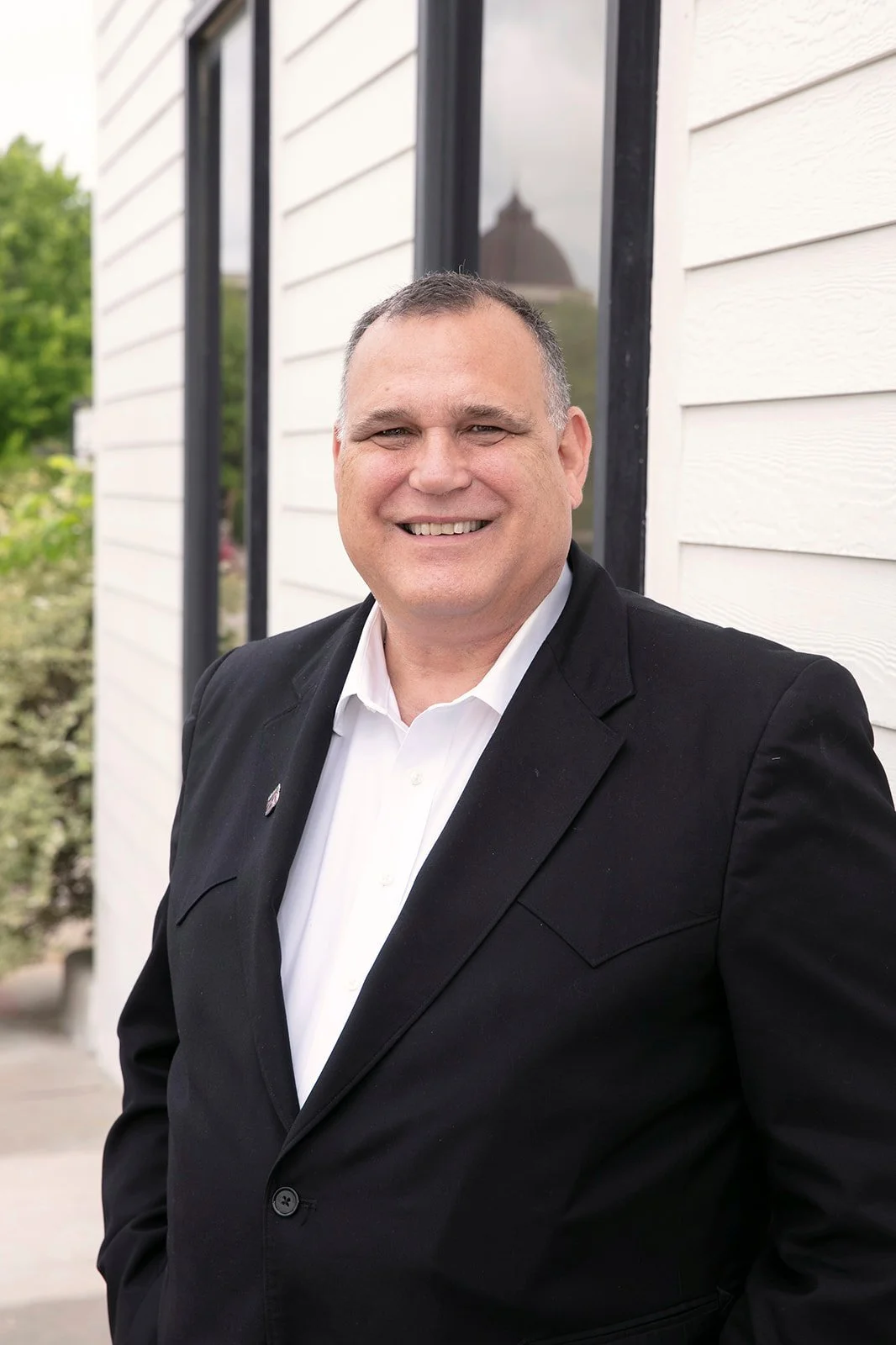 Michael Williamson smiling outside