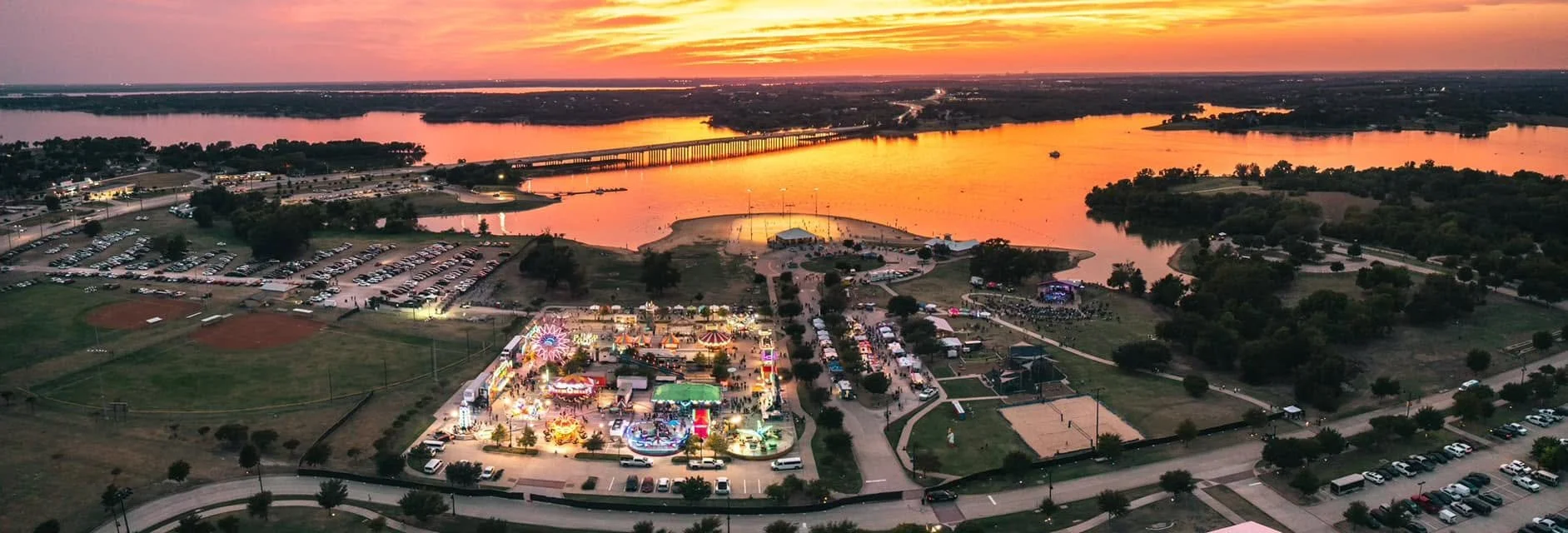 scenic view from drone of lewisville lake and little elm park at sunset
