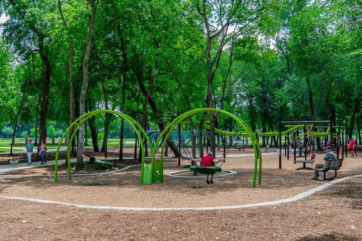 People playing on playground at park