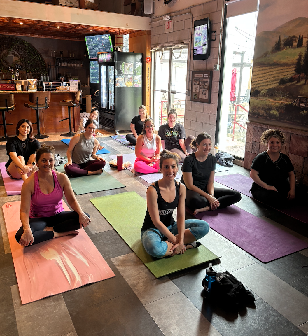 Pinot & Pilates pic on the mats .png