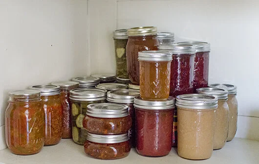 Minnetrista's shelf of canned goods (some rings left on loosely to reduce clutter)