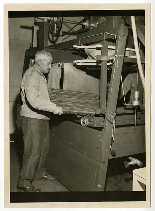 Rowland Webb operating the cider press, undated