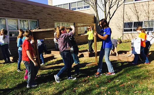 Southside students lay out raised beds.