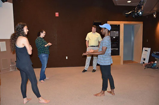 Mason and his actors practicing techniques they have learned.