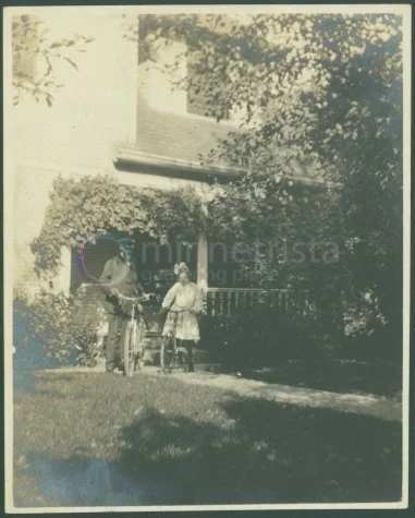 L.L. Ball and daughter Helen in front of their house on the Boulevard