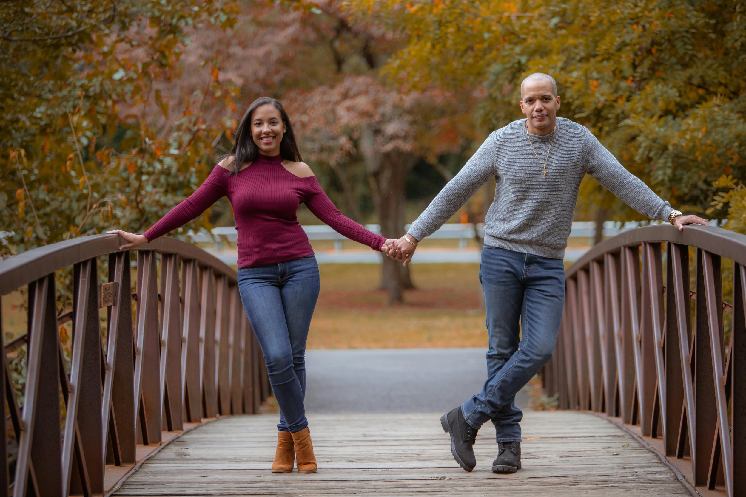 interracial couple holding hands on bridge | marriage counseling Maryland | 20817 | 20814 | 20852 | 20910 | 20815
