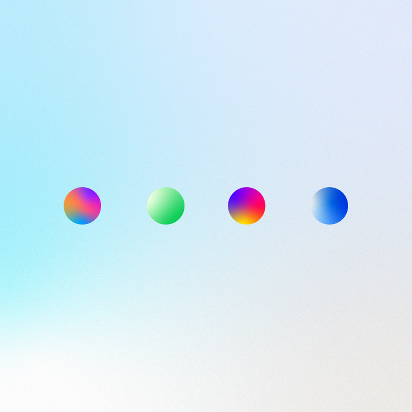 Four colored spheres arranged horizontally on a light gradient background.