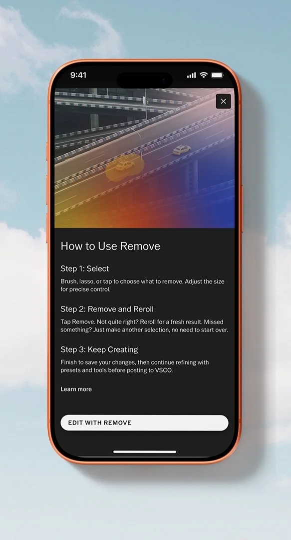 A smartphone displays an app with instructions on how to remove objects from an image, featuring a highway scene with cars, and a yellow highlight on one of the vehicles.