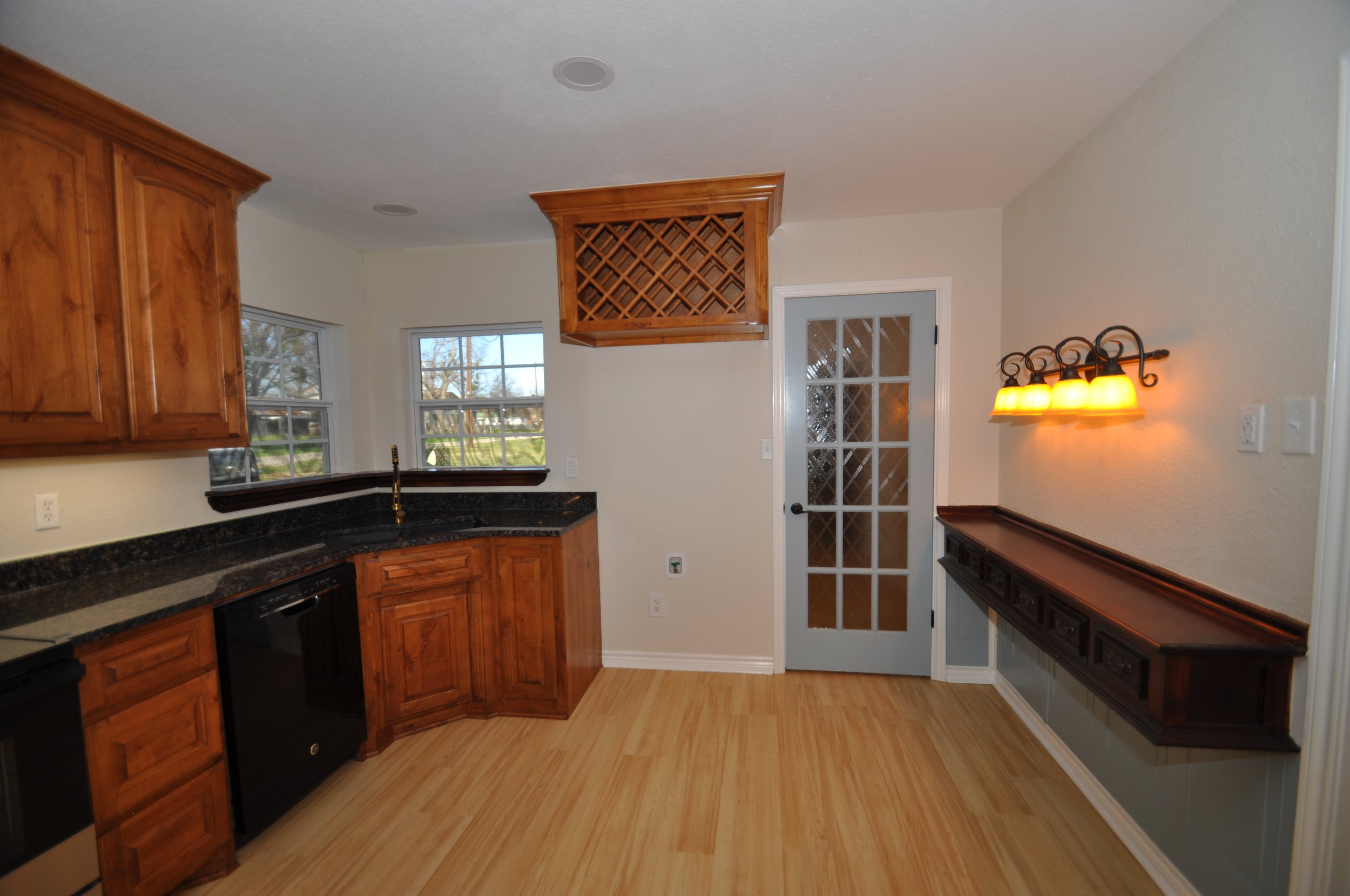 Special addition of vintage side bar with storage drawers and sconce lights. The door opens to the private master bedroom 'ante-room', which could be a small office or peaceful reading/relaxing area.