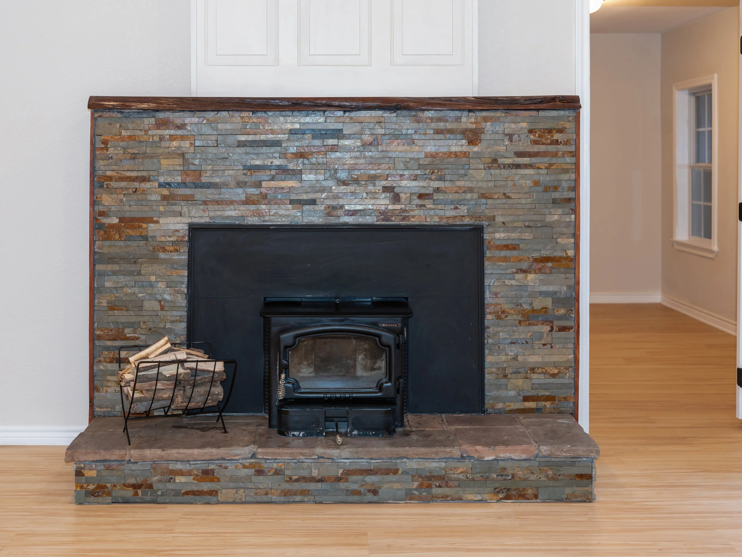 Rock surround on wood burning stove.jpg