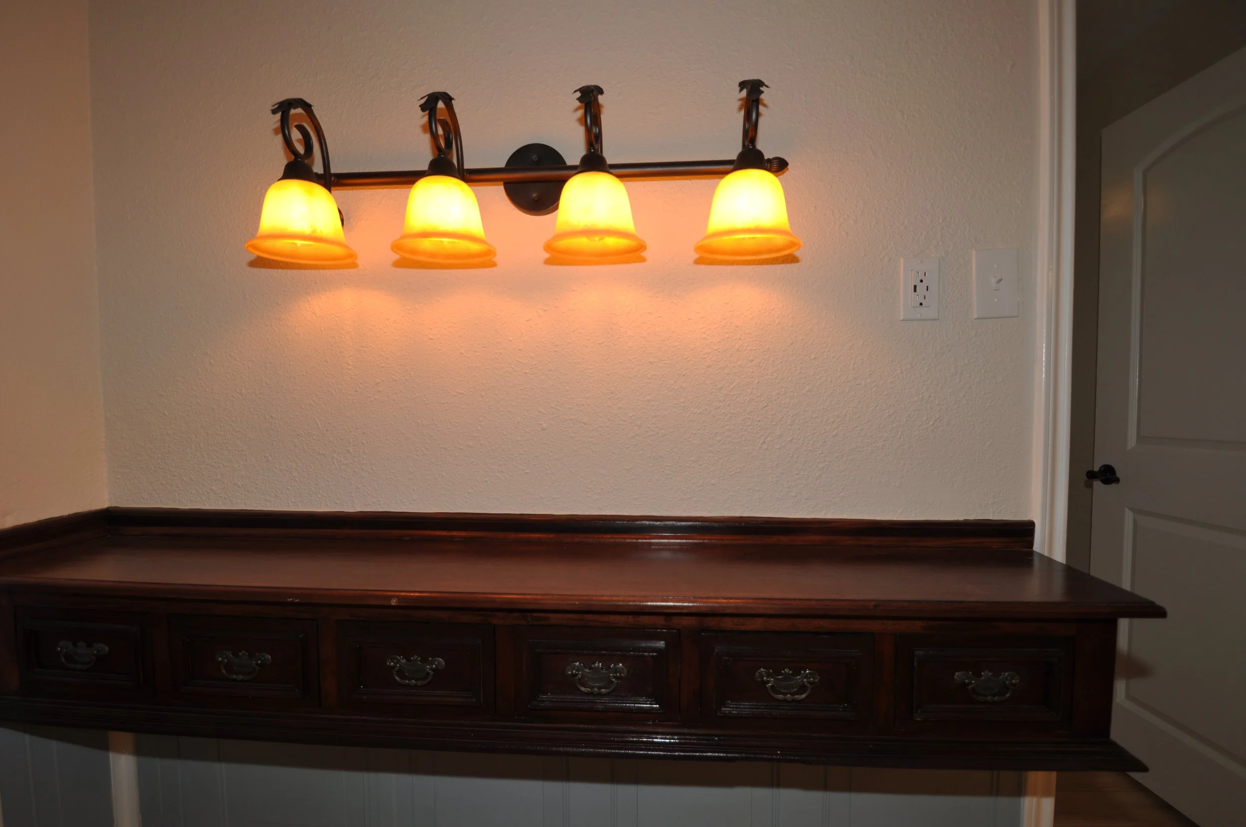 Vintage kitchen side bar. Useful for coffee bar, cocktails or phone charging area. Note the power outlet has a built in USB port!