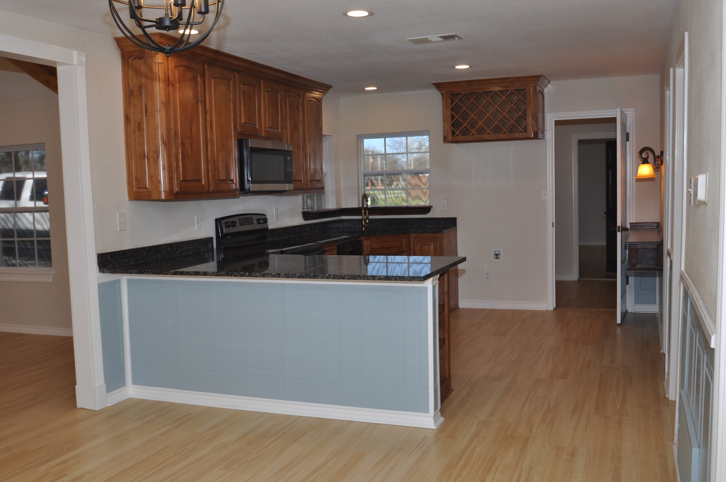 Kitchen from dining. Room for stools at breakfast bar.