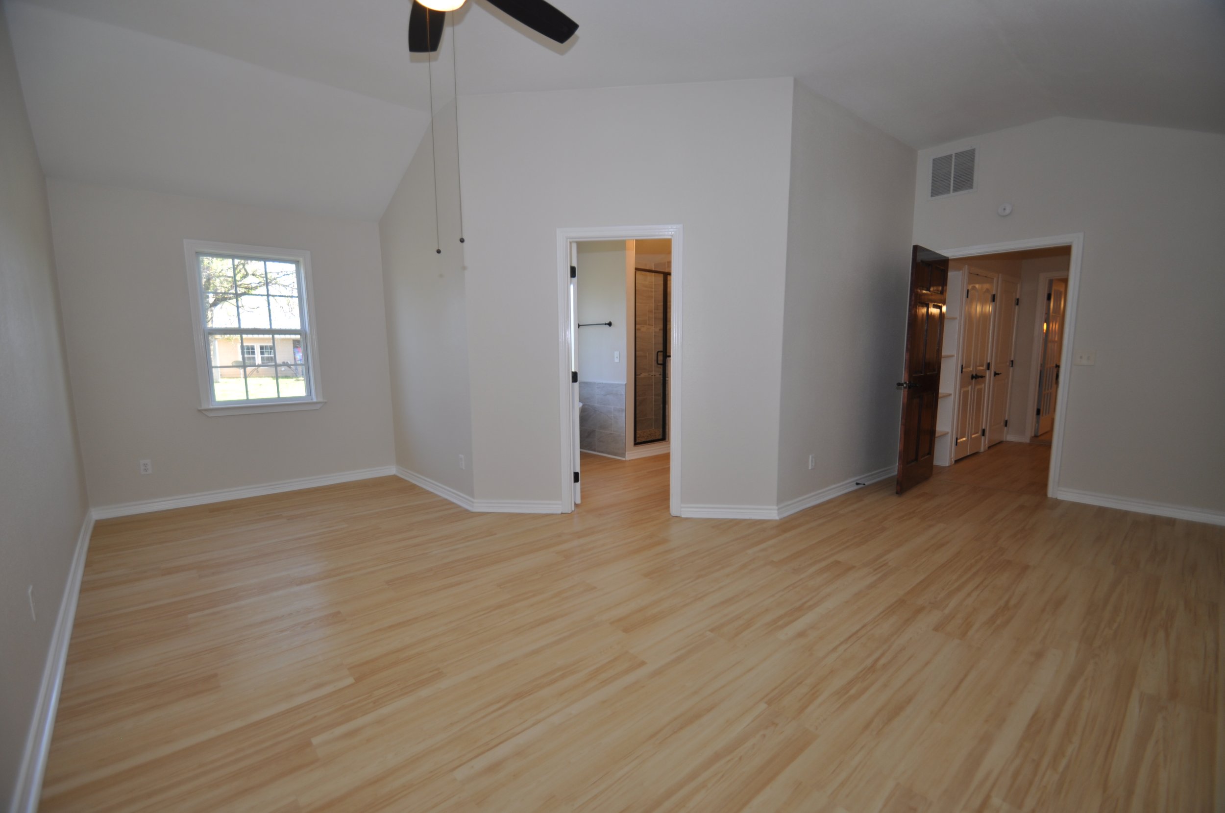 Master bedroom to entrance and bathroom on the left