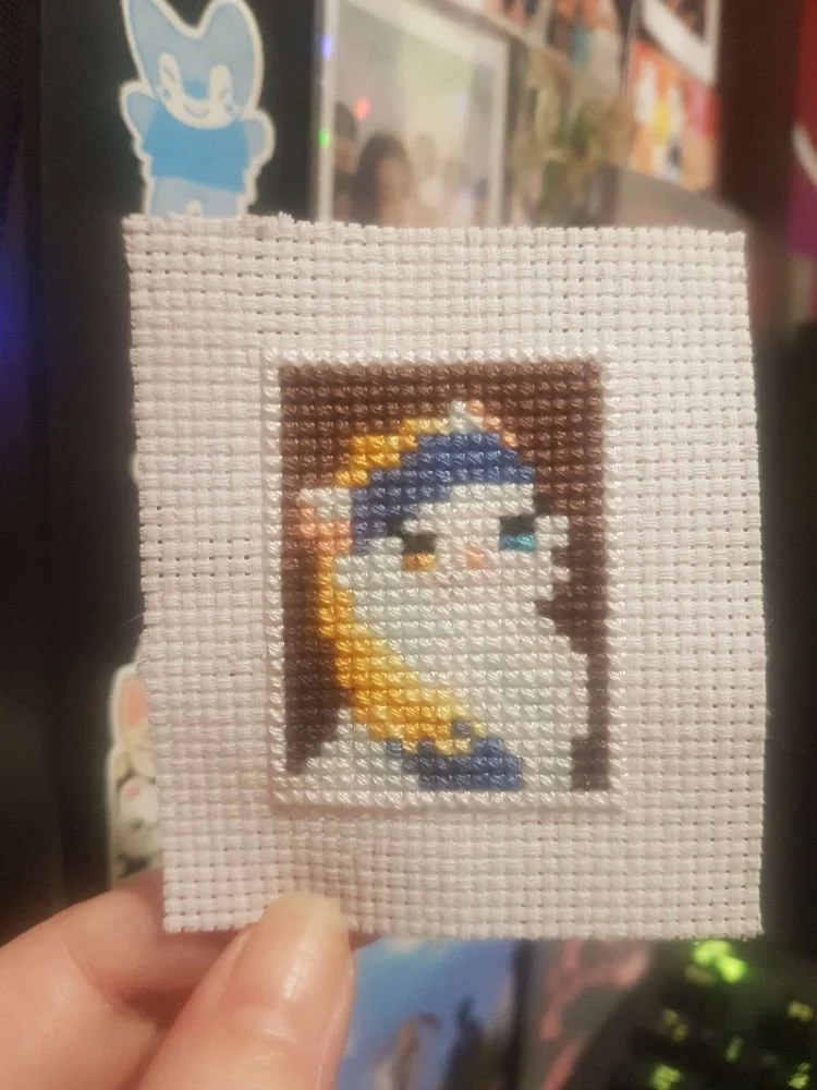 cross stitch- @totoroisonfire.bsky.social