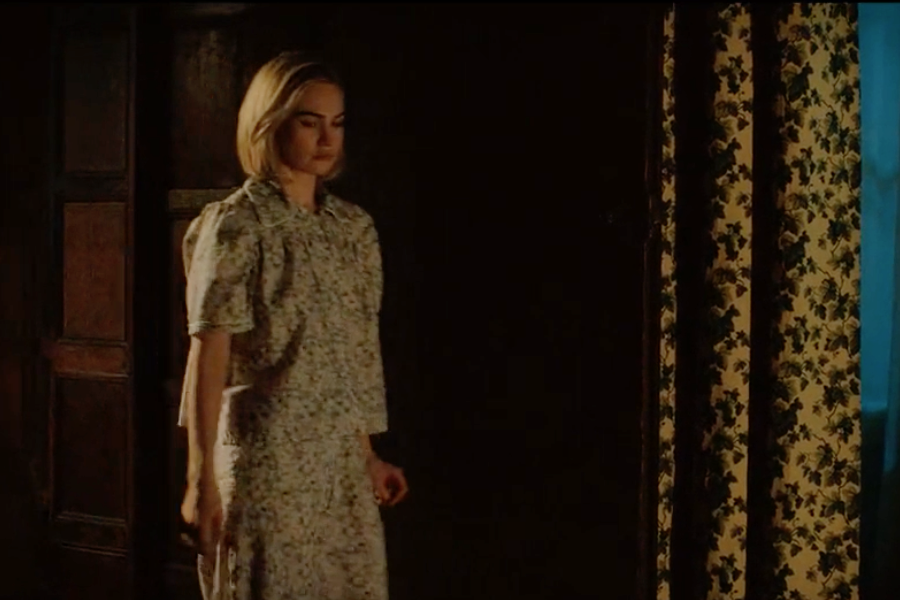 Image of Lily James wearing a 1930s pajamas in the movie "Rebecca"