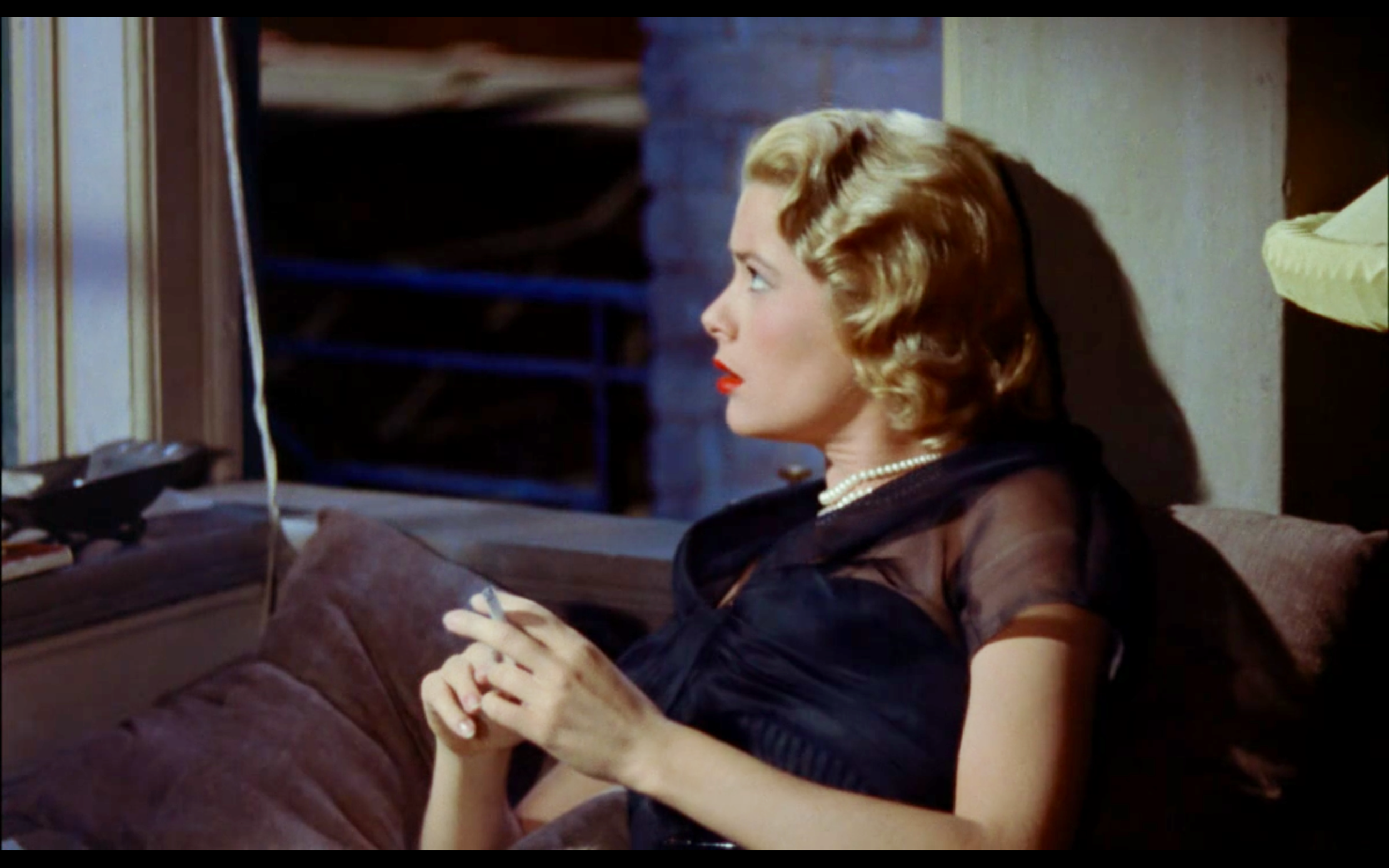 We think she would look equally stylish not smoking the cigarette, although the white does seem to match her pearl necklace… 🤔