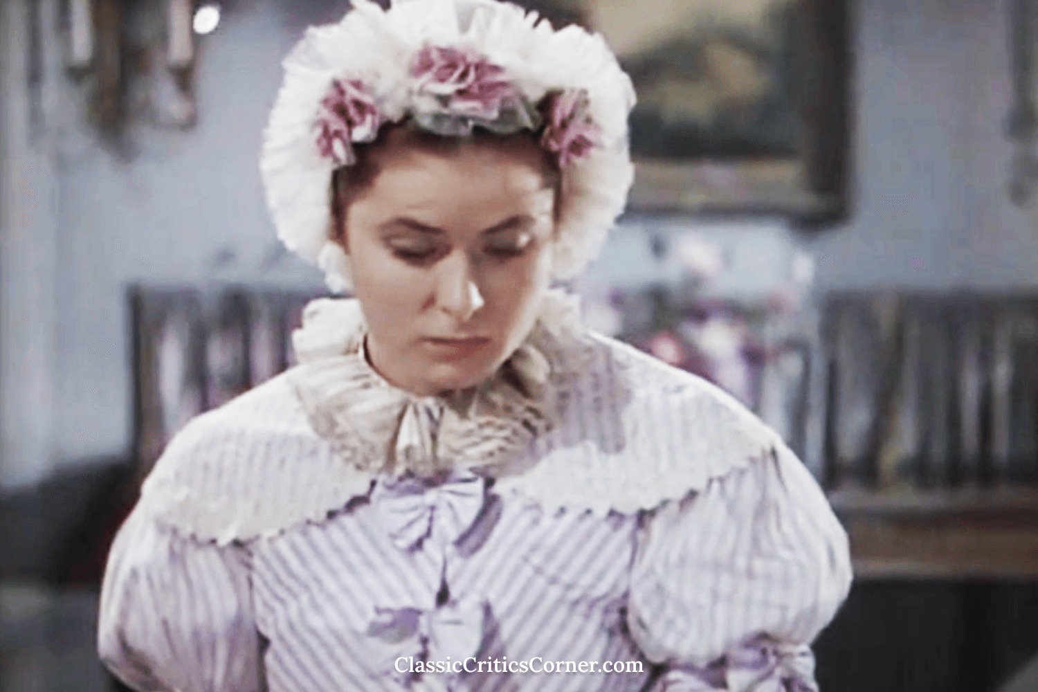 For breakfast in a gothic mansion, Lady Henrietta (Ingrid Bergman) wears a fluffy dress with a lace doily.