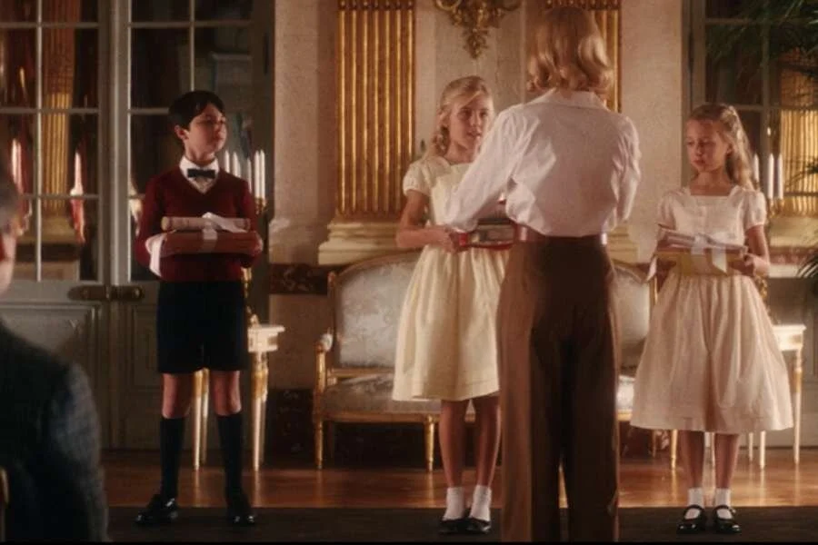 Nicole kidman as Grace Kelly in Grace of Monaco wearing a white blouse tucked into high-waisted pants