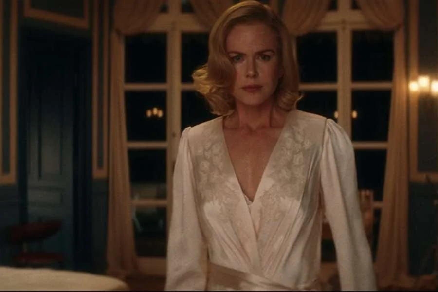 Nicole Kidman as Grace Kelly wearing a silk negligee and robe