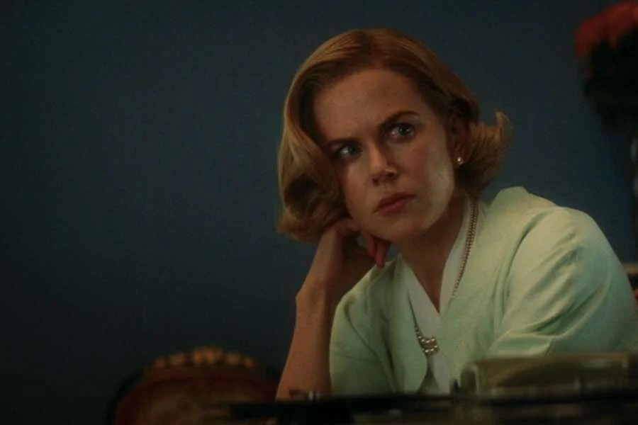 Nicole Kidman as Grace Kelly wearing a green suit