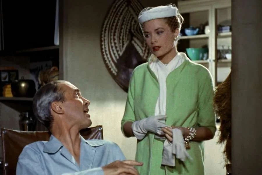 Grace Kelly wearing a green suit in the Hitchcock movie Rear Window